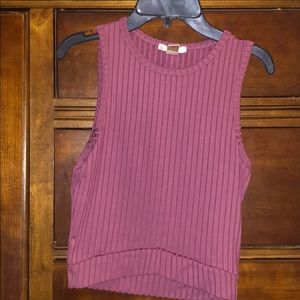 Sleeveless Tee and cropped in front.